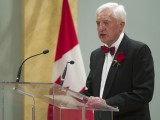 Fraser Taylor speaking at a podium