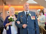 Janice Elliott being escorted down the aisle.