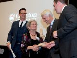 Erica Cherney receives her award from Jerry Tomberlin, Dean of the Sprott School of Business