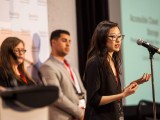 Melody Chen descibres her project on stage.