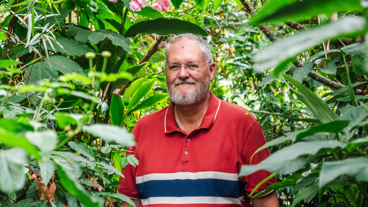 A man poses for a photo at the 2024 Carleton Butterfly Show.