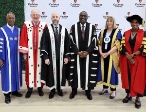 University President Wisdom Tettey stands with former University President Benoit-Antoine and other university presidents.