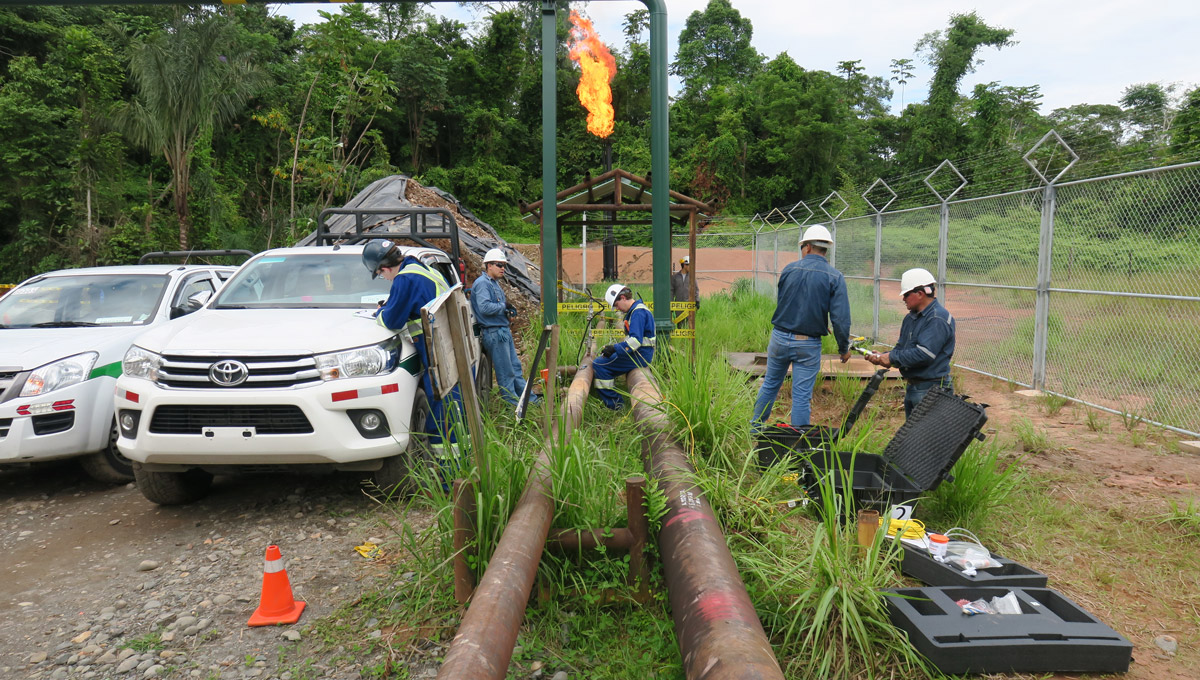 The FlareNet sets up their equipment next to an oil and gas line in Ecuador.