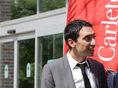 Prof. Burak Gunay attends an outdoor announcement about funding for his research.