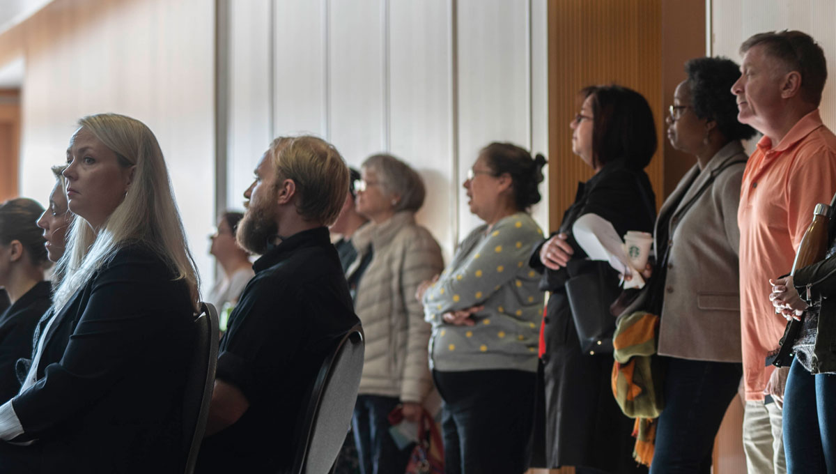 A crowd of attendees listen to presentations at the Psychology Mental Health Day.