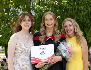 A graduating student and her supporters take a photo following a convocation celebration.