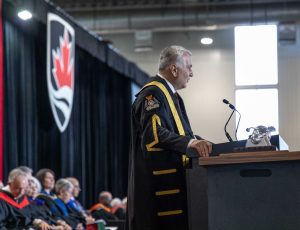 Nikita (Nik) Nanos speaks during his installation ceremony.