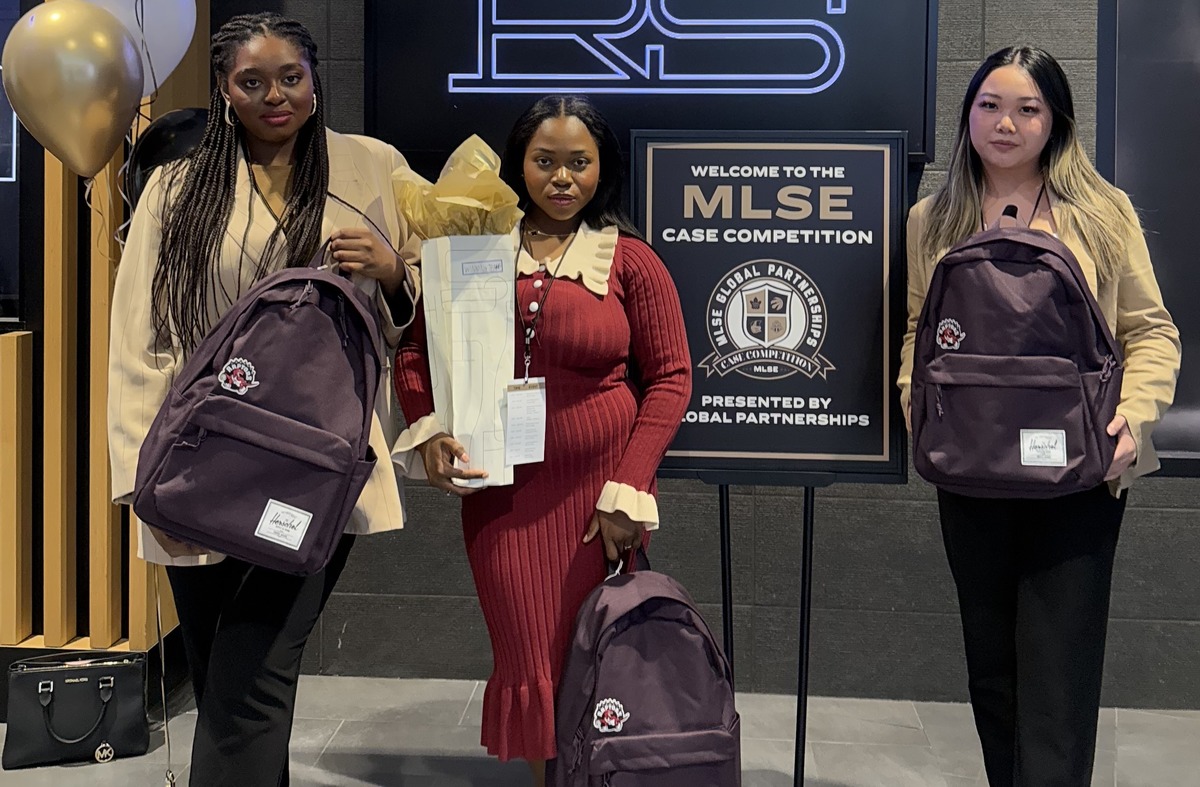 Winning team members pose for a photo with their awards. From left to right: Jahnelle Woldegiorgis, Itoro Umanah and Lauren Tham.