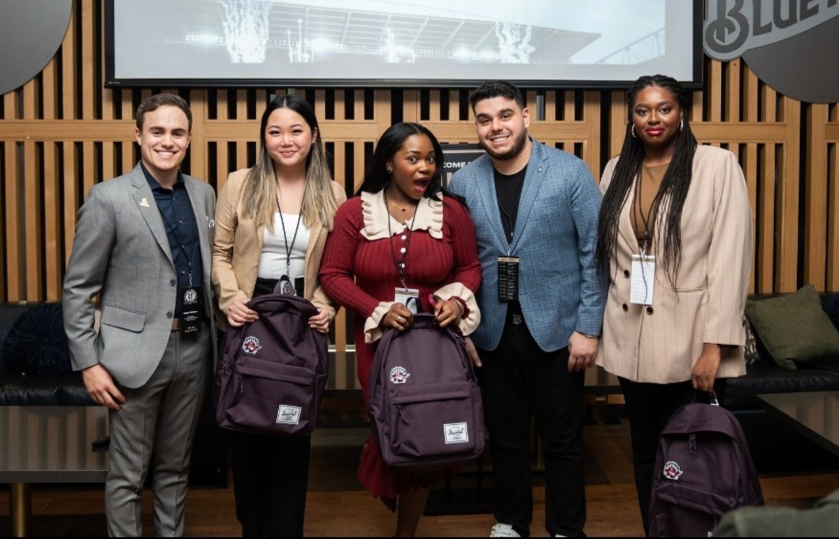 Winning team members Lauren Tham (second from left), Itoro Umanah (centre), Jahnelle Woldegiorgis (right) and competition officials.