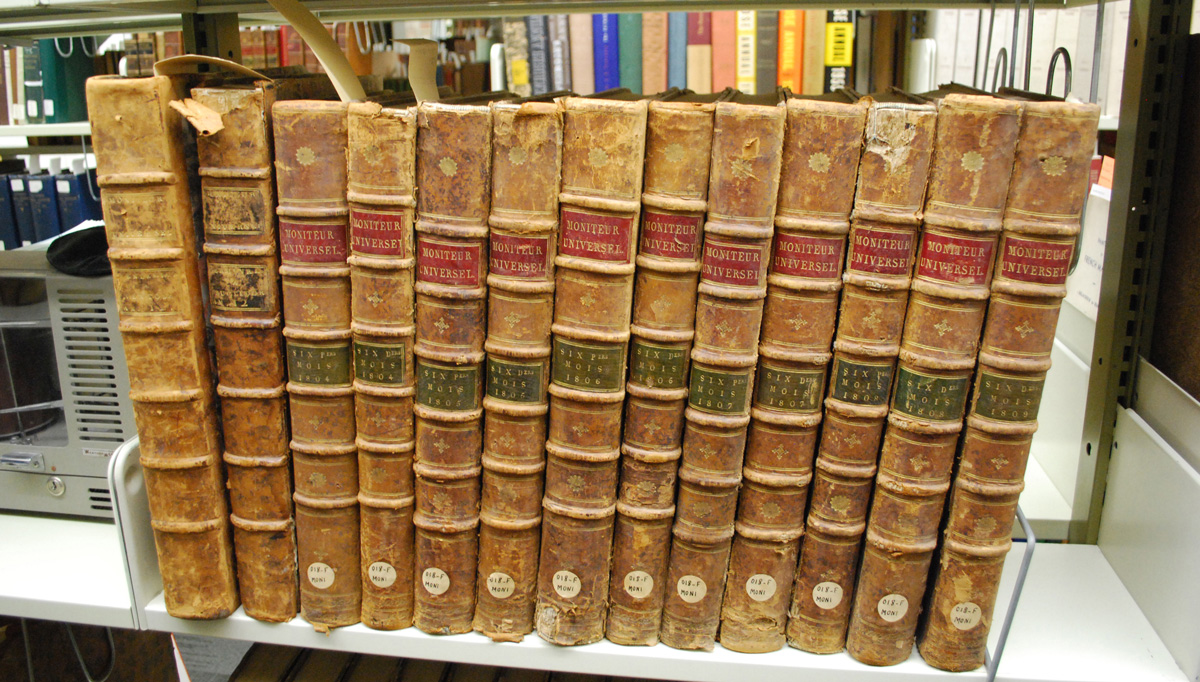 A photo of books on a shelf in the library.