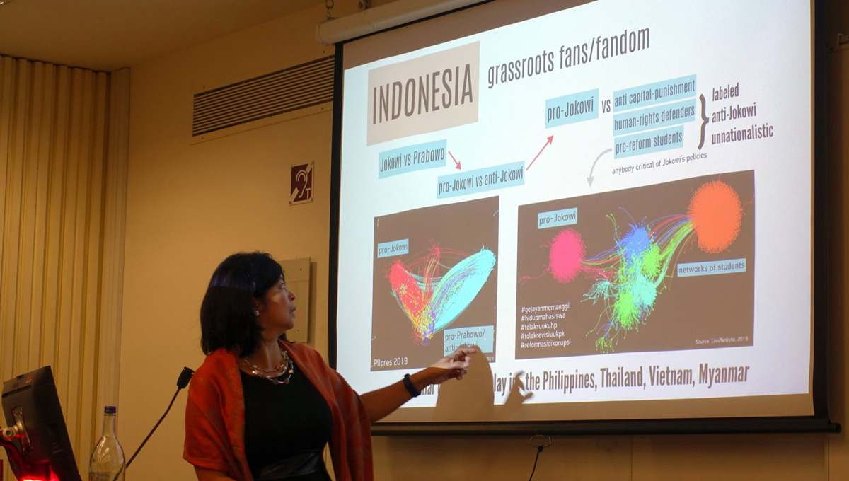 Prof. Lim delivers a presentation in a classroom.