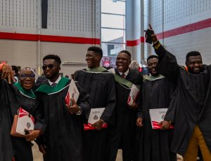 Students celebrate in the Ravens Nest after receiving their degrees