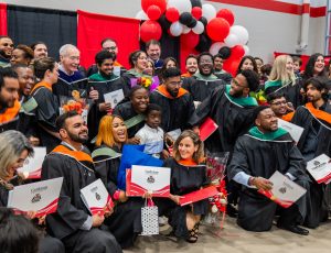 Graduating students from the Technology Innovation Management Program gather for a photo in the Ravens Nest.