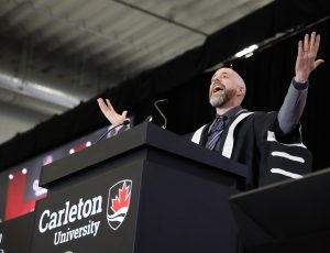 Carleton's president gives a speech at the podium