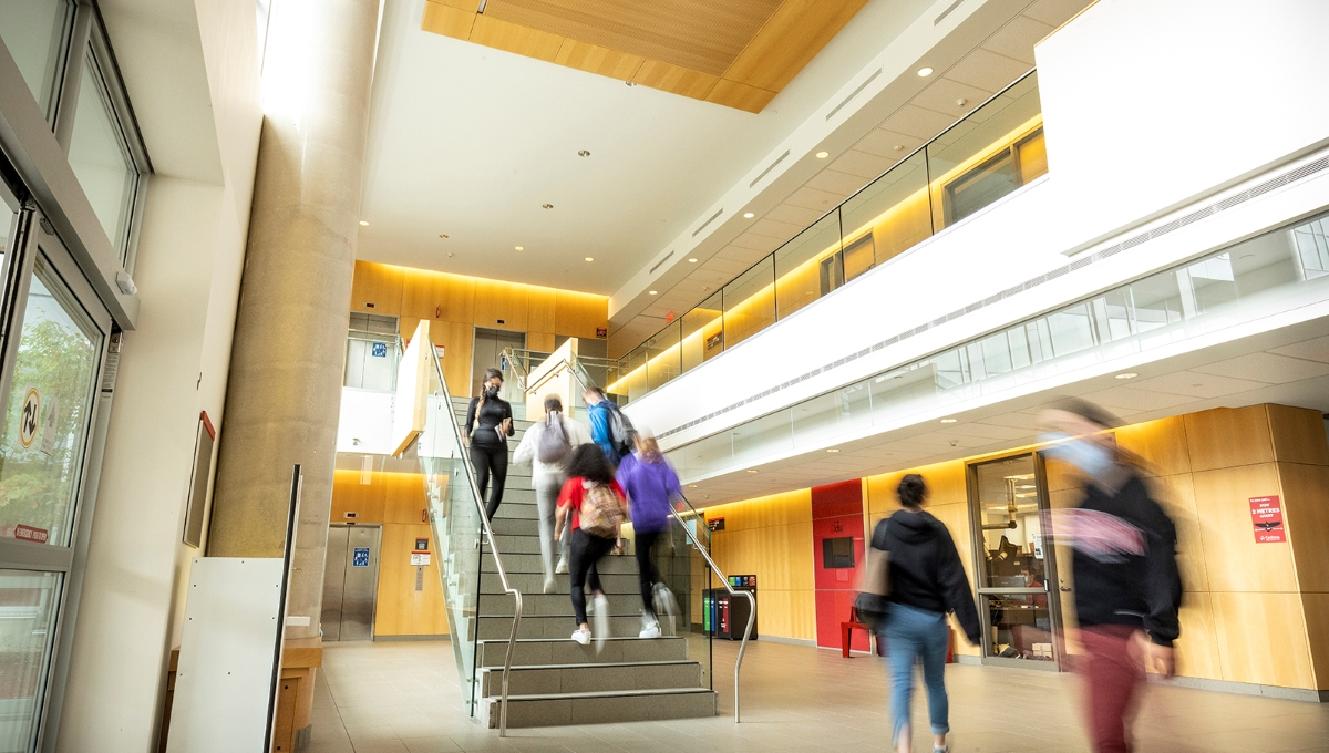 Students walking up the stairs in building on Carleton campus.