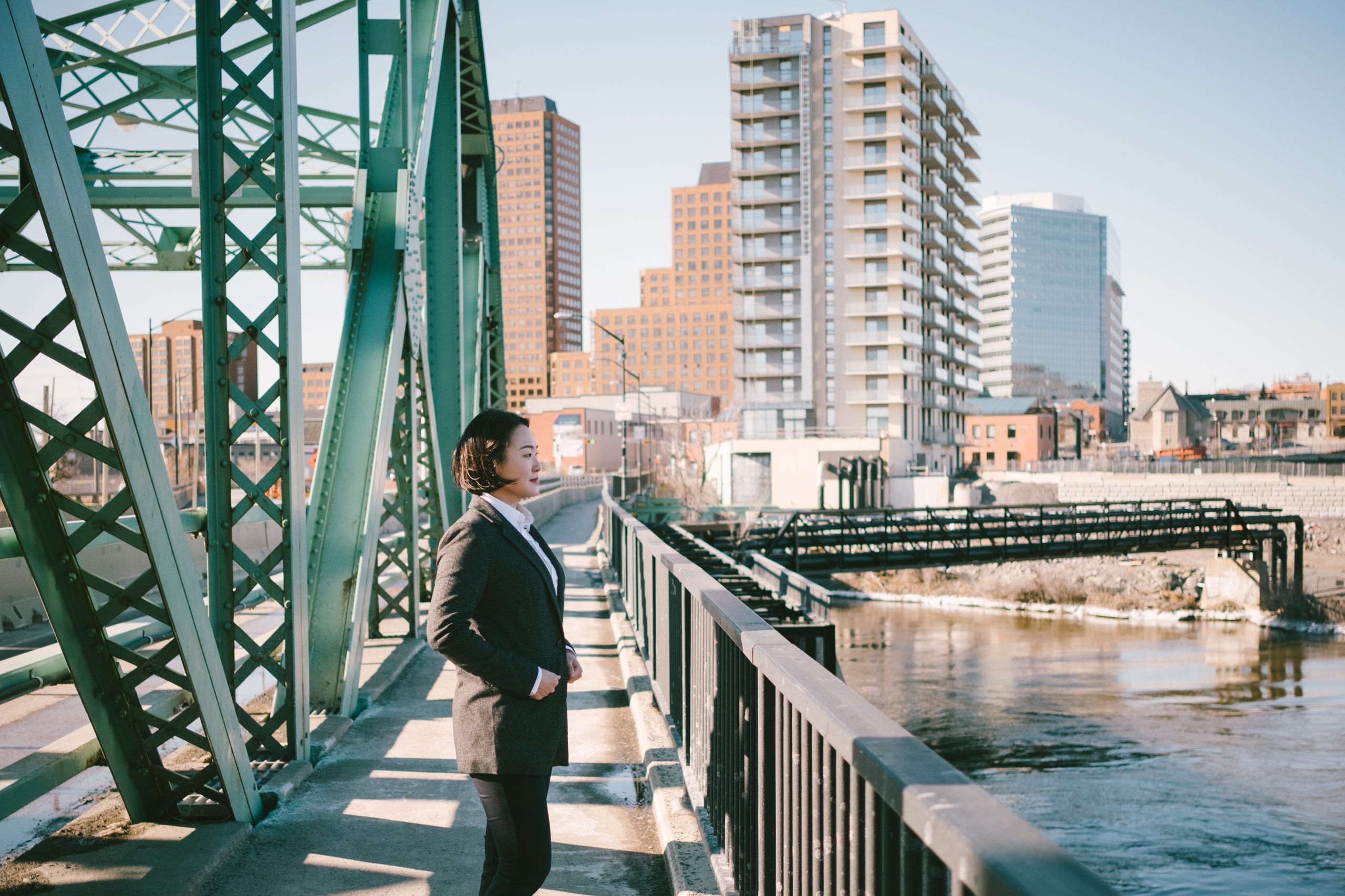 Prof. Kim standing on a bridge overlooking the Ottawa River