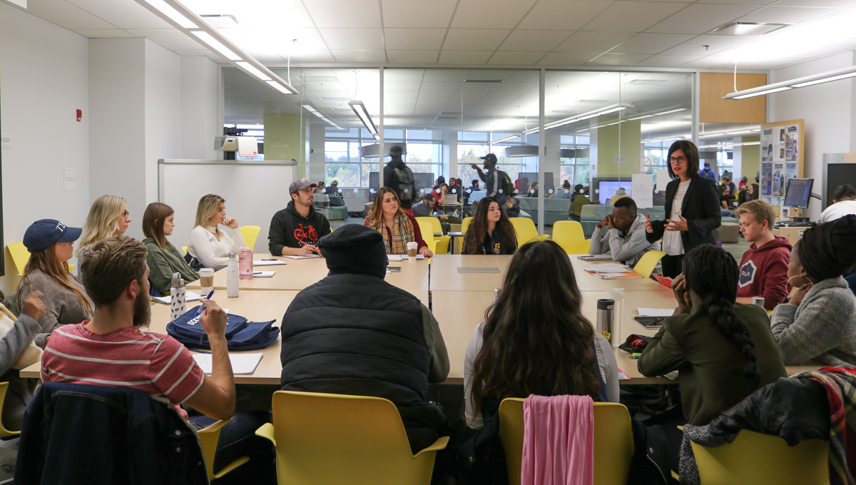 Prof. Melanie Adrian teaches a class in the Discovery Centre