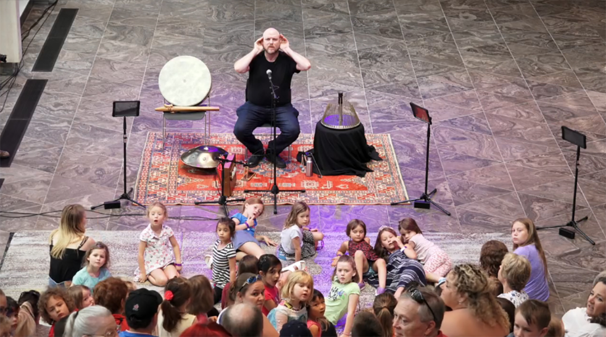 Jesse Stewart performs at the NAC with an audience of children and their families as part of the We Are All Musicians Project.