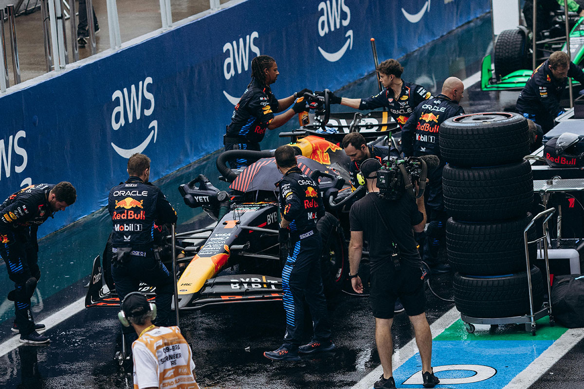 A pit crew working on a race car.