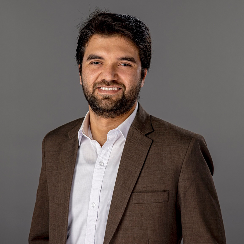 A professional headshot of Adnan Khan, a Carleton AI researcher.