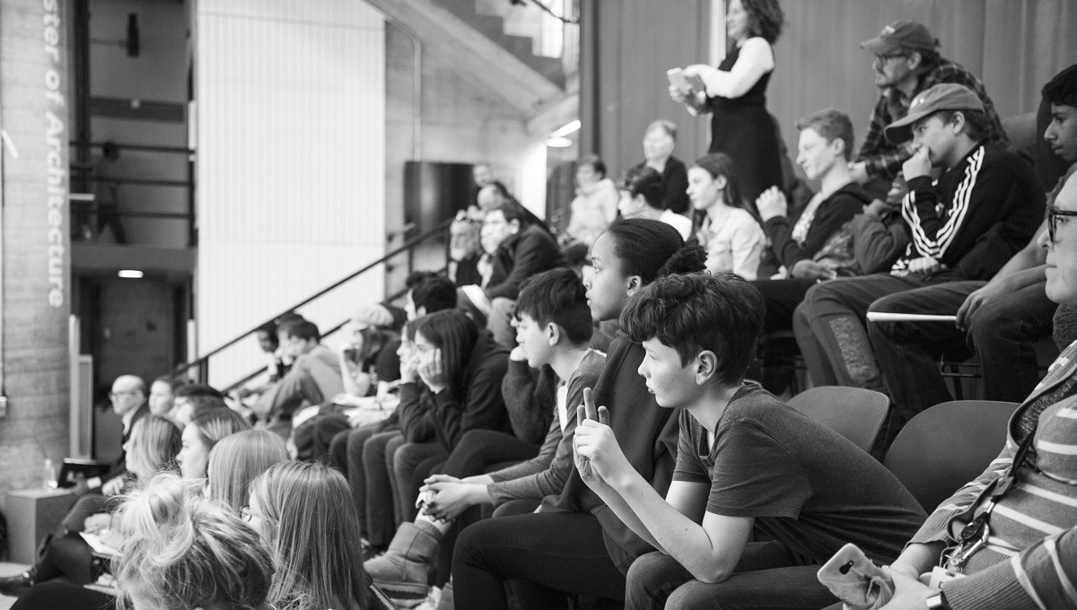 Elementary students listen to a presentation in Carleton's Architecture Building.