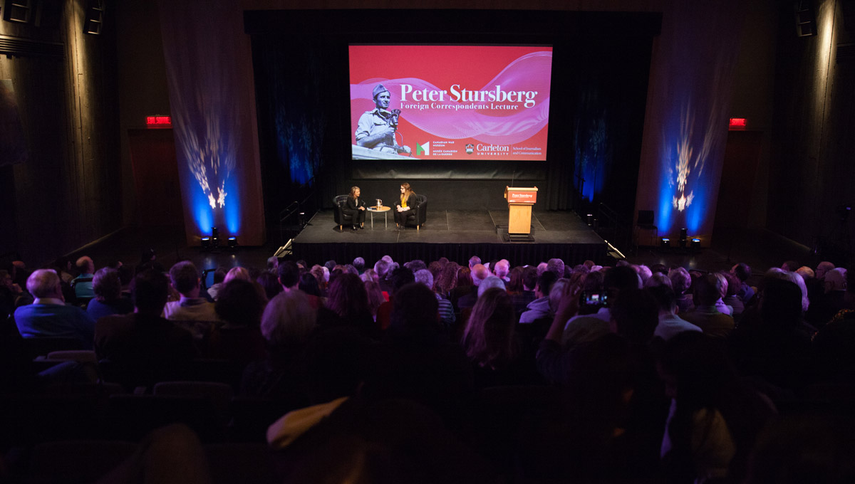 A wide angle view from the vantage point of the audience as Adrienne Arsenault and Kristy Kirkup sit together on-stage for a post-lecture interview