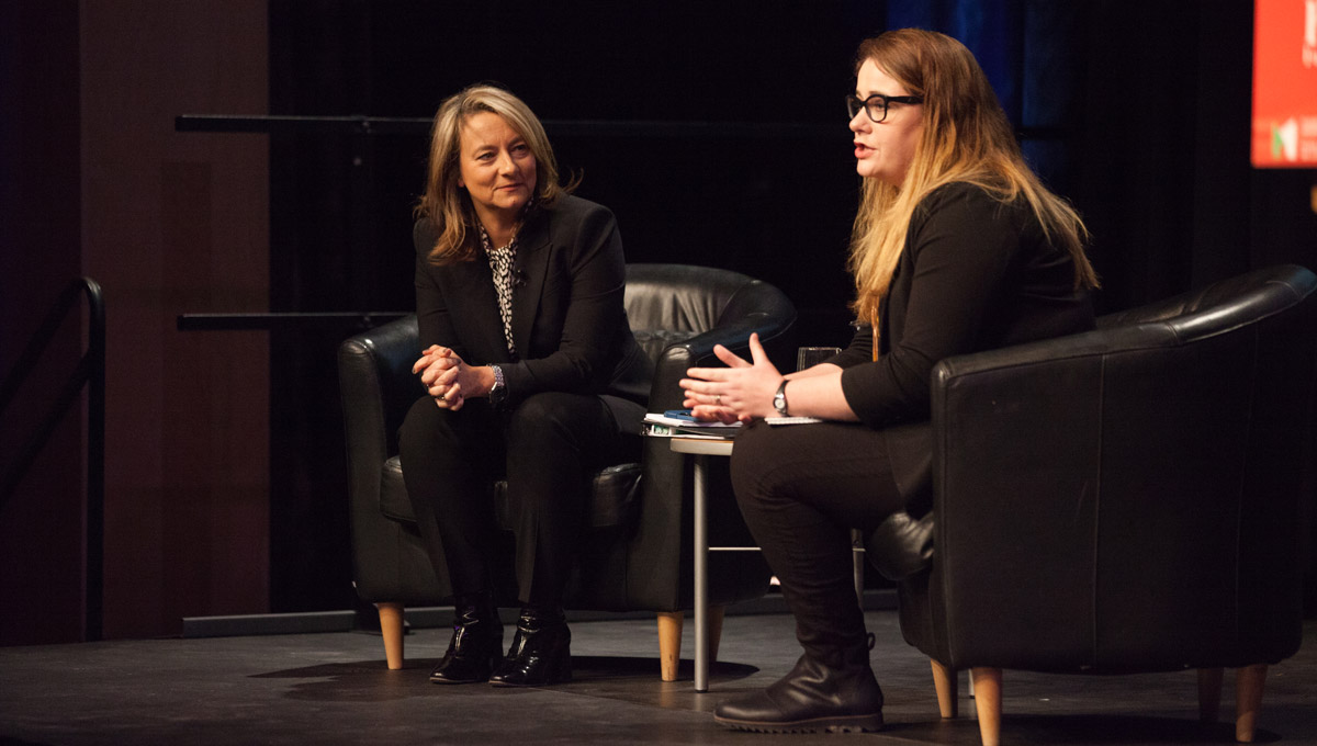 Adrienne Arsenault and Kristy Kirkup sit together on-stage for a post-lecture interview/