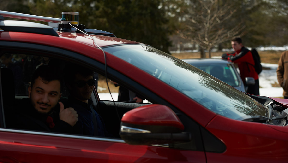 A student gives the thumbs-up during the Autonomous Vehicles demonstration.