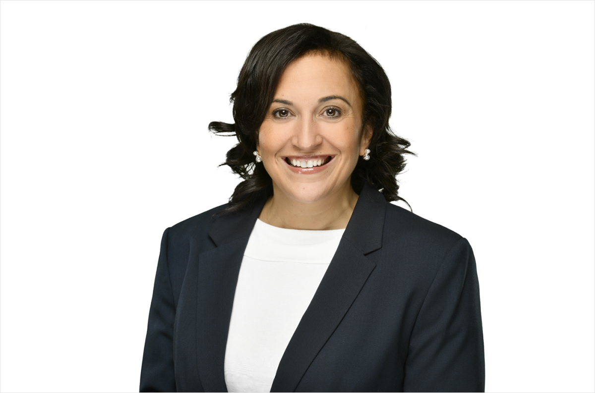 A professional photo of a woman wearing a business suit.