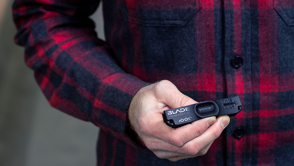 A photo of the Blade Barber hand-held skate sharpener, a black object roughly 5-6 inches in length.