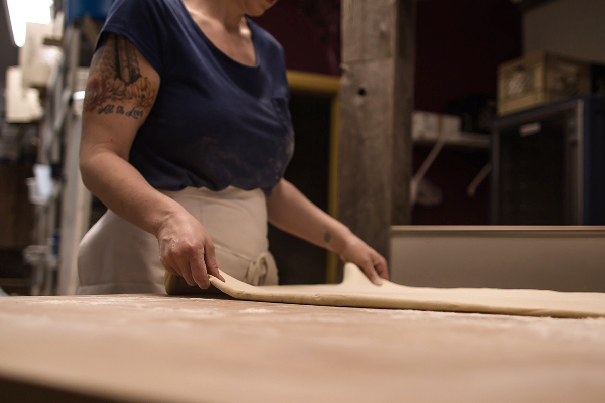 A woman making bread.