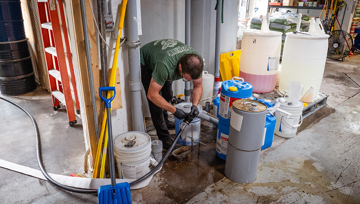 A man working inside a brewing facility.