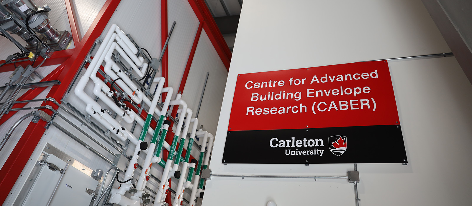 The inside of a research facility with sign that reads: Centre for Advanced Building Envelope Research (CABER)
