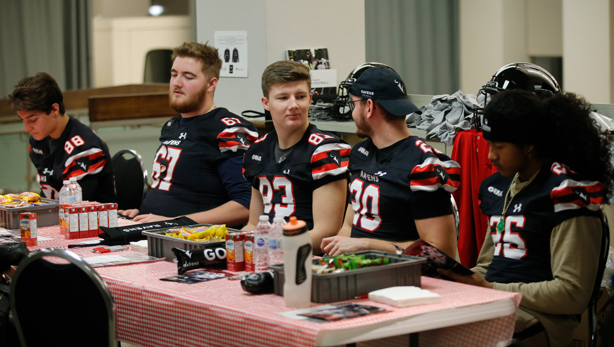 The Ravens men’s football team eats cookies after donating blood during a blood drive in which they helped collect an impressive 78 pints of blood on Nov. 30, 2018.