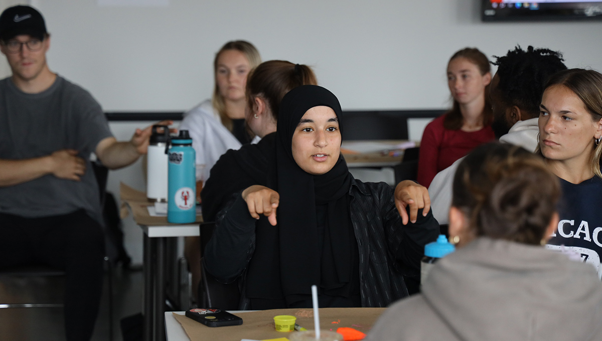 Students interacting in a classroom setting.