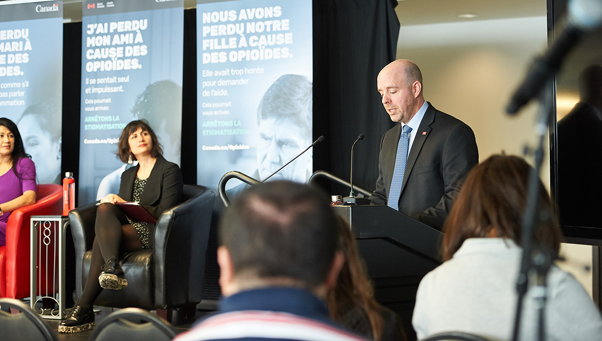 President Bacon addresses the audience at a 2019 panel discussion on the impacts of stigma amid the opioid crisis