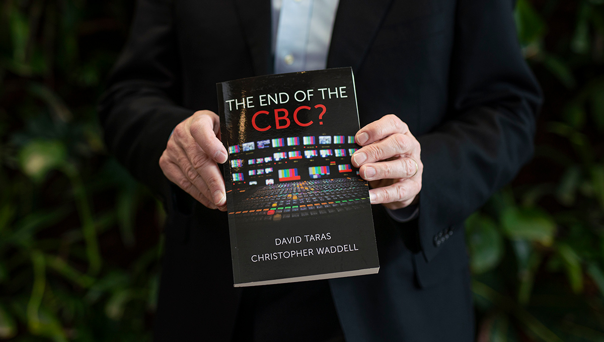 Waddell holds his new book The End of CBC?