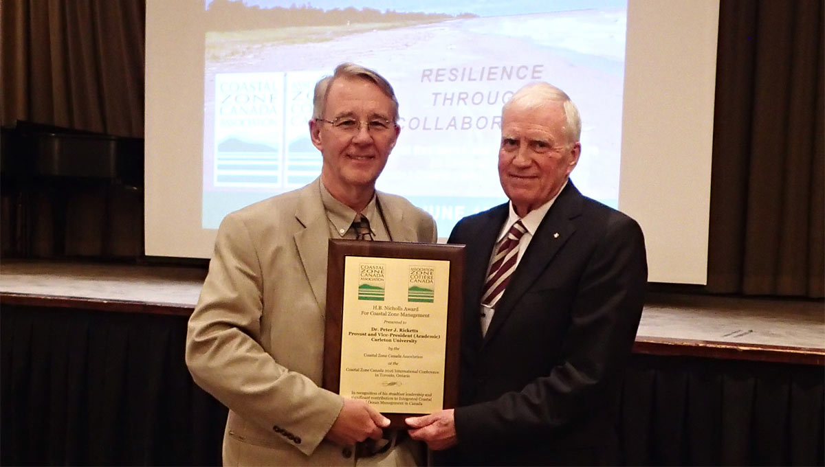 Michael Parkes presents Carleton’s Peter Ricketts with the H.B. Nicholls Award at the Coastal Zone Canada Association conference in Toronto.