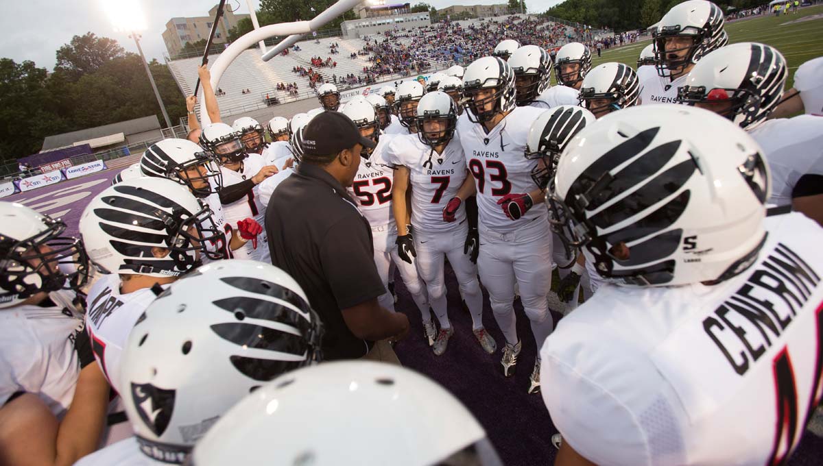 The Ravens huddle up during a game versus the Ottawa Gee-Gees.