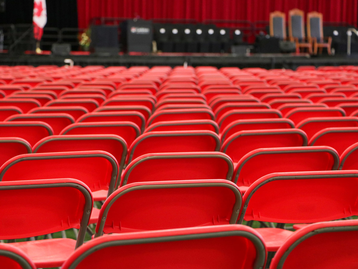 Empty chairs wait to be filled in the Fieldhouse in between ceremonies.