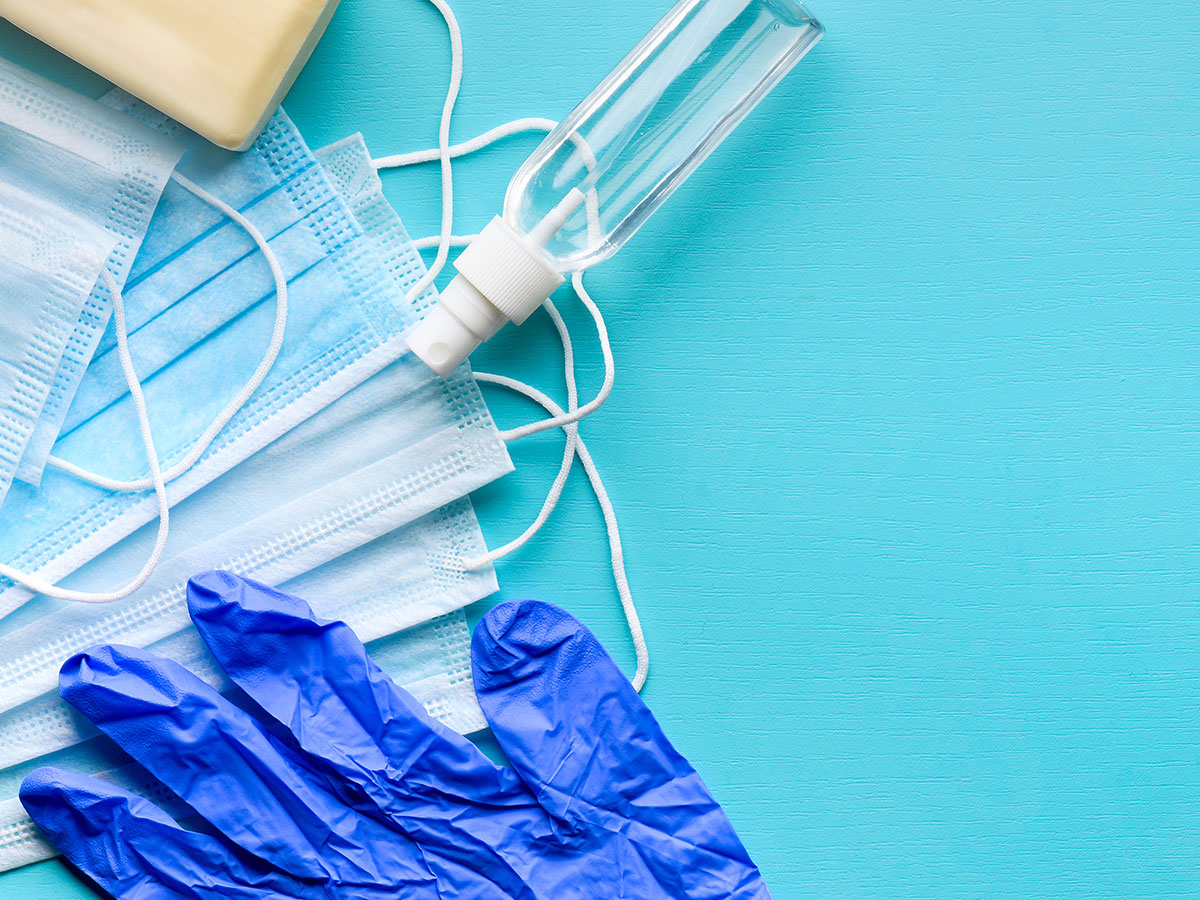 Stock image o medical mask, gloves and vaccine on a bright blue background