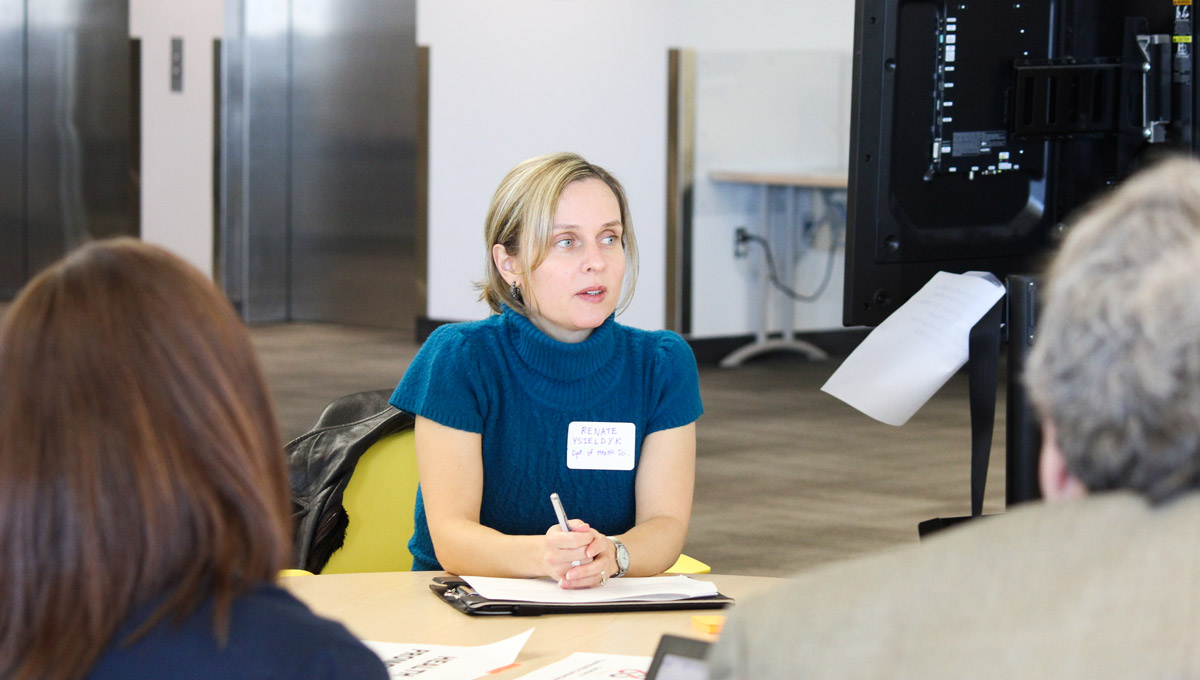 Renate Ysseldyk networks with attendees during the conference.