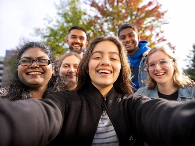 Students taking a group selfie