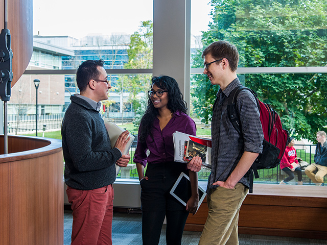 Three Carleton University students having a discussion