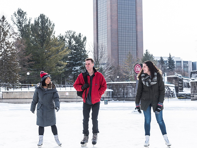 Three young people skating together