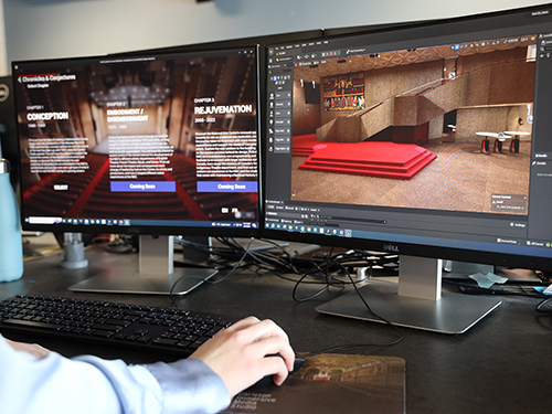 An over the shoulder view of someone using a computer to create digital models of the interior of a building.