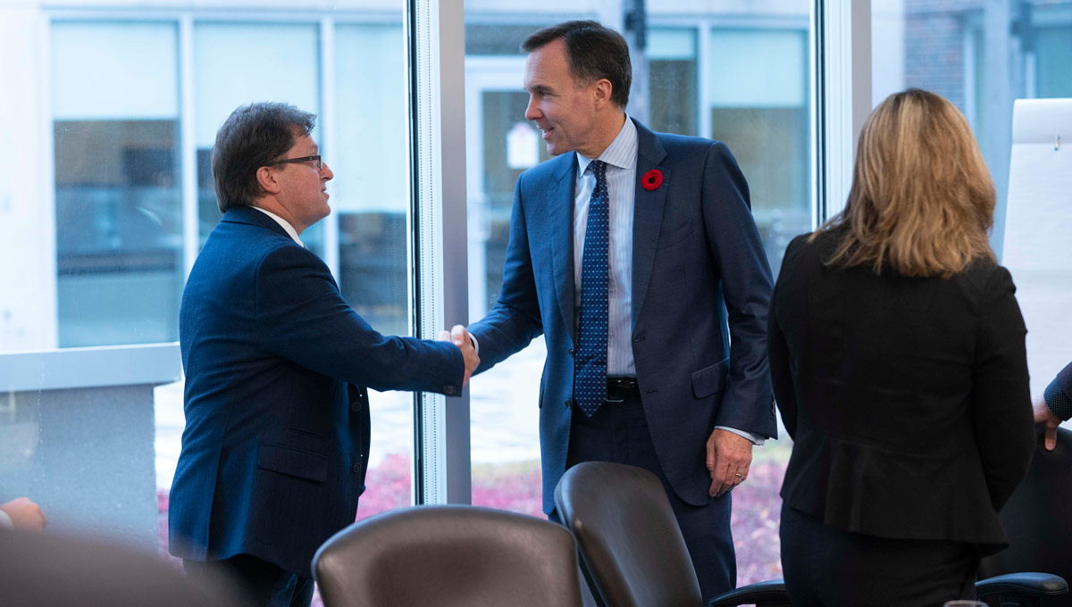 Bill Morneau shakes hands with an event attendee. The Honourable Bill Morneau, Minister of Finance, on behalf of the Honourable Amarjeet Sohi, Canada's Minister of Natural Resources, announced changes to Canada's Energy Efficiency Regulations to help Canadian homes and businesses save money by using more energy-efficient products. The announcement took place at Carleton in October 2018.