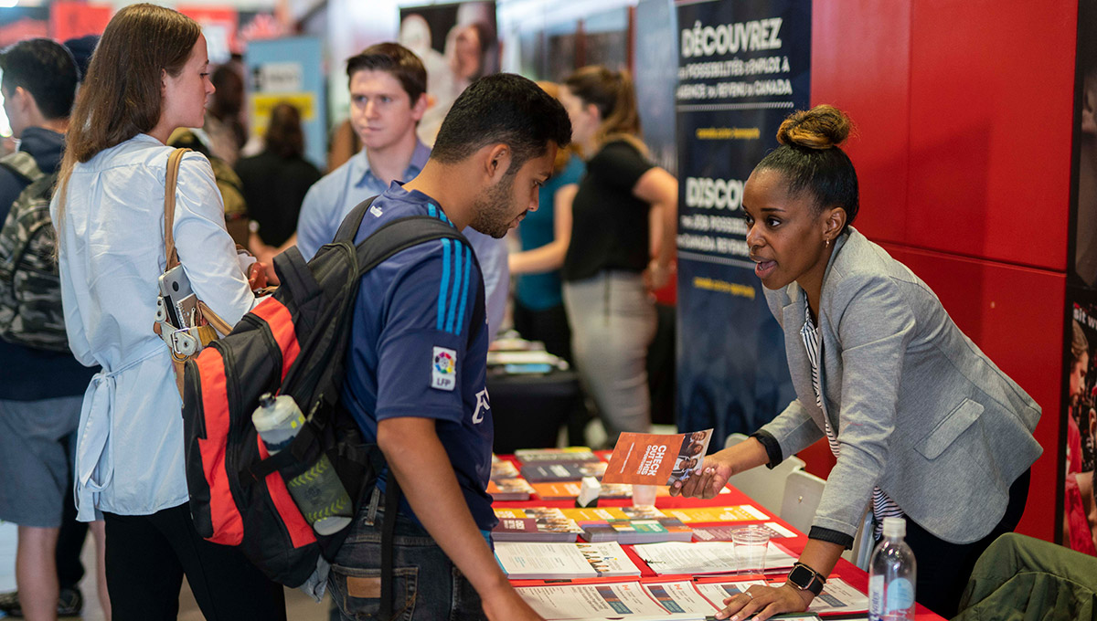 A student receives information at a recent career fair
