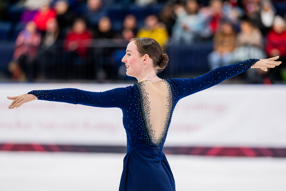 A figure skater performing for an audience.