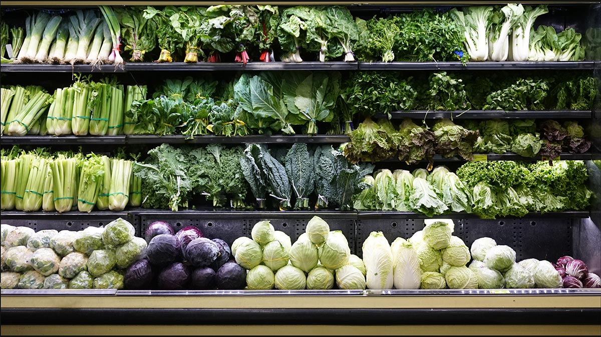 Fresh green produce on shelf in grocery store for sale
